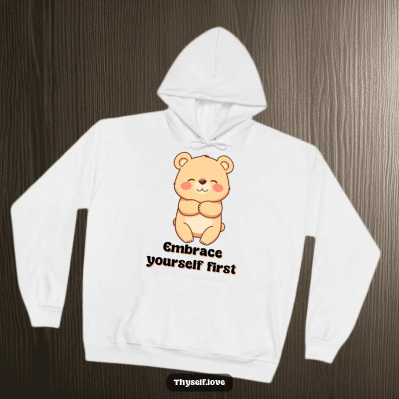 Funny hoodie depicting a bear character happily hugging itself, offering warmth, comfort, and a touch of humor.