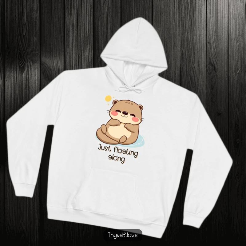 Funny hoodie featuring a perfectly relaxed otter floating on its back, soaking up the gentle sun, a symbol of ultimate comfort.
