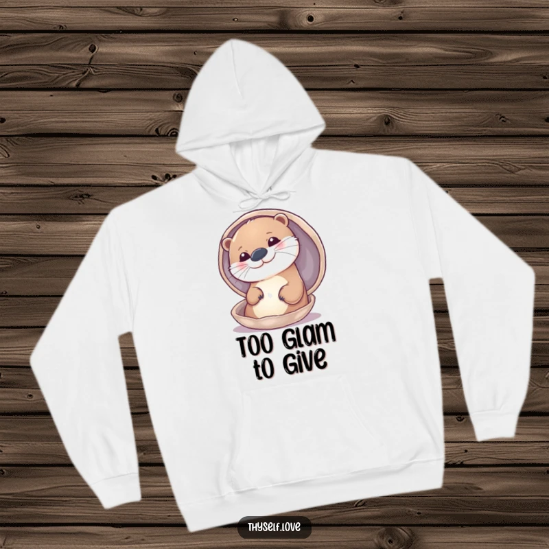 Funny hoodie depicting a cheerful otter admiring its handsome face in a reflective shell, feeling its best.